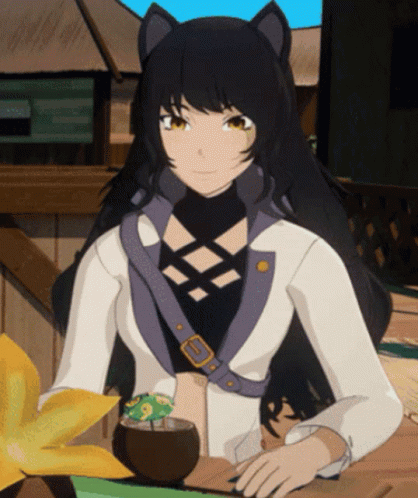 Girl with Cat Ears Sitting at Table with Drink