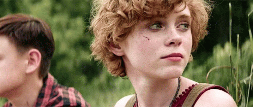 Girl With Curly Hair Next To Boy In Plaid Shirt GIF