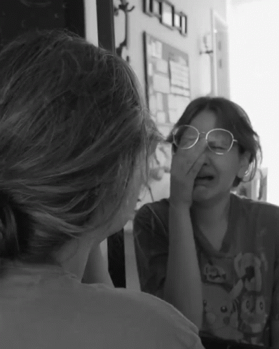 Girl With Glasses in Mirror