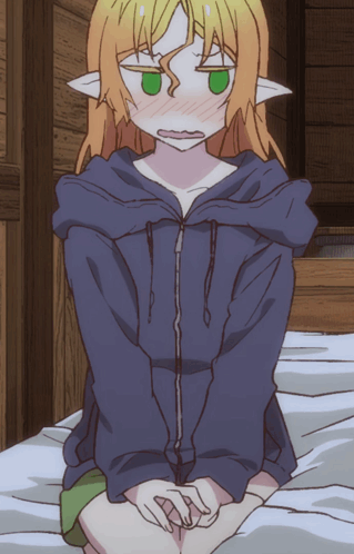 Girl with Green Eyes Sitting on Bed in Blue Jacket