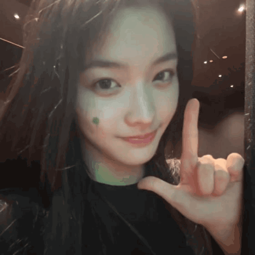 Girl with Green Spot Peace Sign