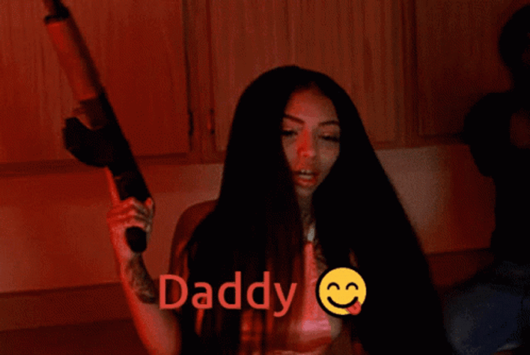 Girl With Gun Calls Daddy GIF