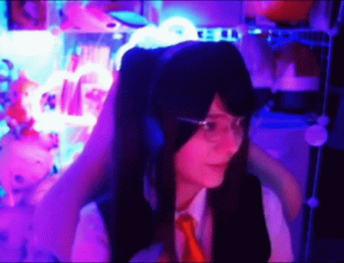 Girl With Headphones and Glasses in Purple Lights