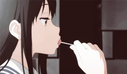 Girl With Long Black Hair Licking Stick GIF
