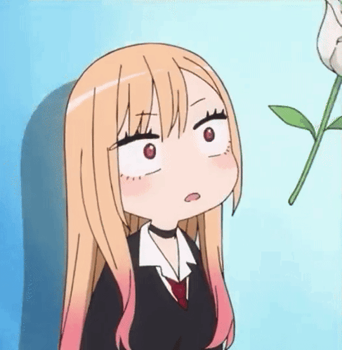 Girl With Long Blonde Hair Making Funny Face Next To Plant GIF