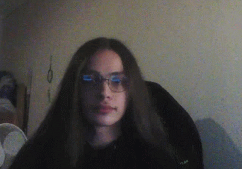 Girl With Long Hair and Glasses in Black Shirt