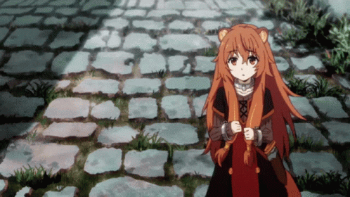 Girl With Long Red Hair on Brick Walkway