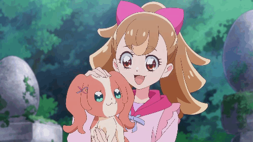 Girl With Pink Bow Holding Dog GIF