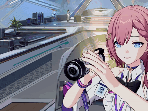 Girl With Pink Hair Holding Camera and Name Tag Saying A