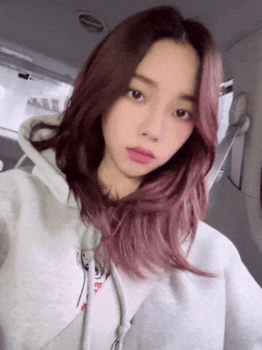 Girl With Pink Hair In Grey Hoodie Taking Selfie GIF