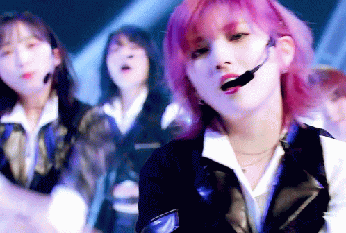 Girl With Pink Hair Singing Into Microphone GIF