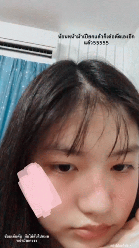 Girl With Pink Sticker on Cheek