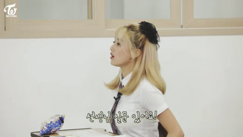 Girl With Ponytail in Classroom With Korean Writing