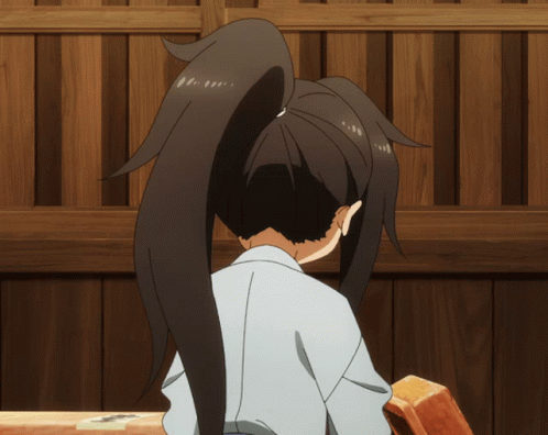 Girl With Ponytail Sitting In Front Of Wooden Fence GIF
