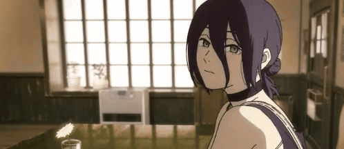 Girl with Purple Hair Sitting at Table