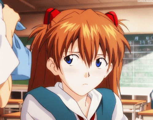 Girl With Red Hair and Blue Eyes in Classroom With Currentlrising