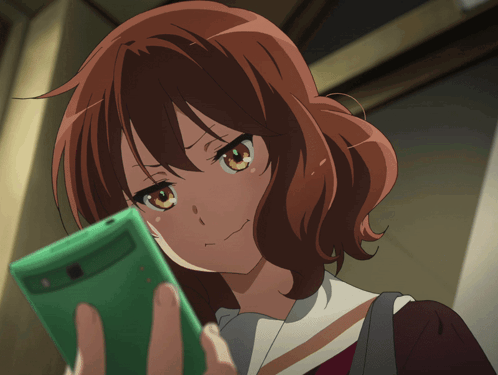 Girl With Red Hair Holding Green Cell Phone