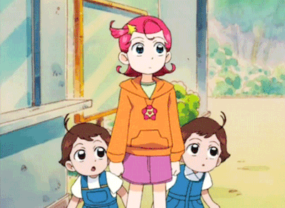 Girl With Star in Hair Next to Twin Boys