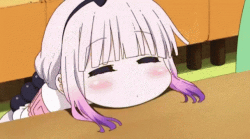 Girl With White and Purple Hair Laying on Table Eyes Closed
