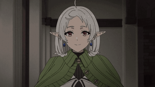 Girl With White Hair and Elf Ears in Green Cape
