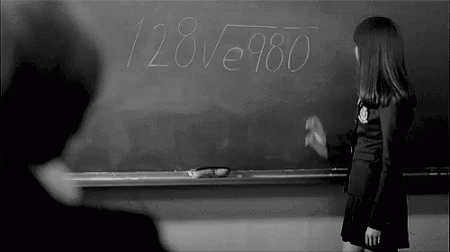 Girl Writing on Blackboard with Chalk