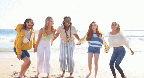 Girls Jumping in Air on Beach