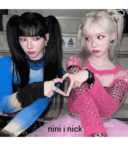 Girls Making Heart Shape with Fingers