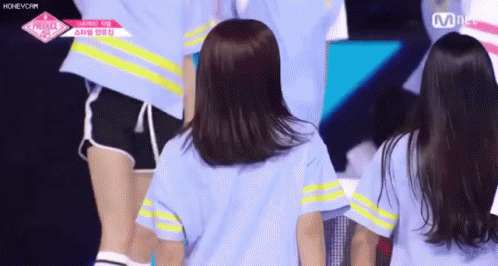Girls on Stage One in Blue and Yellow Striped Shirt