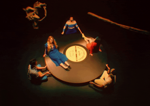 Girls Sitting On Spinning Vinyl Records GIF