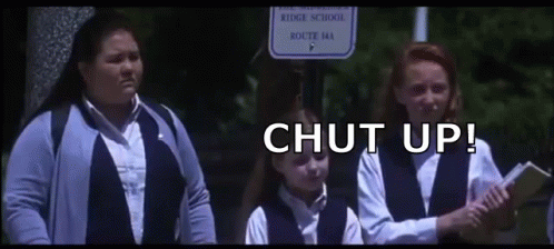Girls Standing at Ridge School Sign