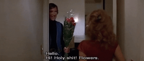 Giving Flowers To Young Woman GIF