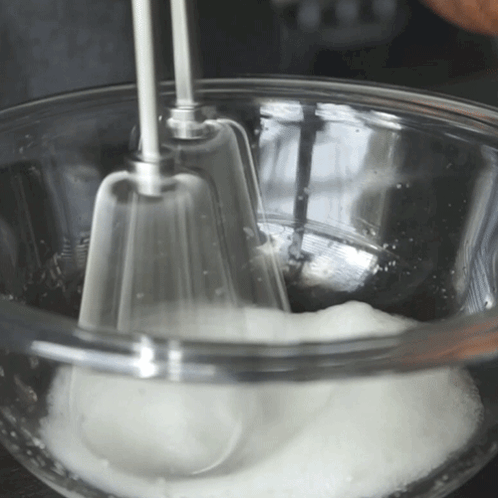 Glass Bowl of Whipped Cream With Mixer