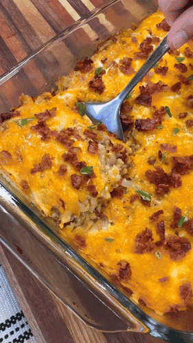 Glass Casserole Dish With Rice, Cheese, Bacon and Spoon
