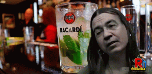 Glass Of Bacardi Next To Woman's Face GIF