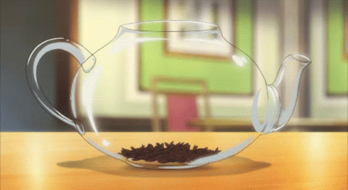 Glass Teapot Filled With Tea Leaves GIF