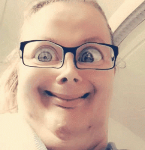 Girl In A Glasses Playing With Filters GIF