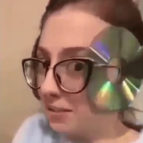 Cd And Glasses Worn By A Girl GIF