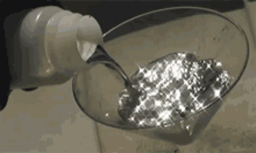 Glitter Water Pouring In Wine Glass GIF