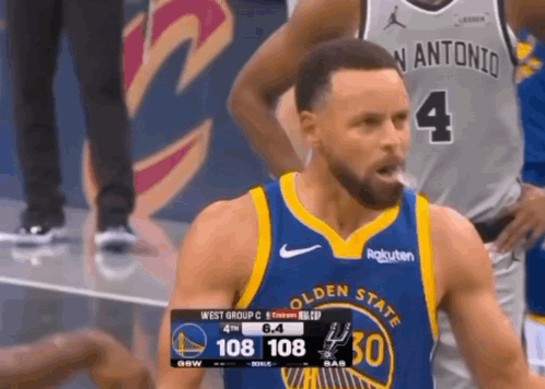 golden state warriors basketball player stephen curry is smoking a cigarette during a basketball game .