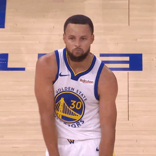 Golden State Warriors Basketball Player Stephen Curry Wearing A White Jersey With The Number 30 On It GIF