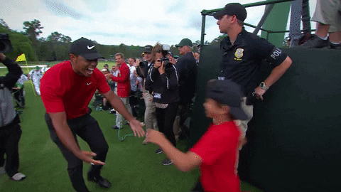 Golf Player Hugging Son GIF