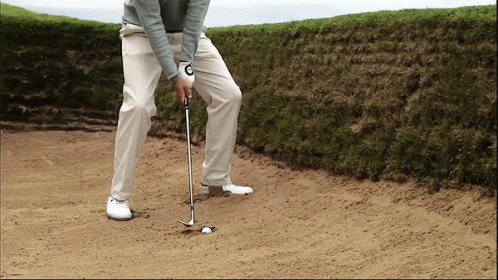 Golfer With C on Glove Hitting Ball