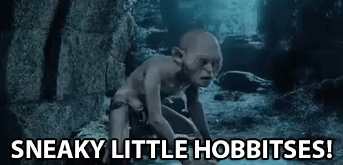 Gollum From The Lord Of The Rings Is Crawling On The Ground In A Cave And Saying `` Sneaky Little Hobbitses ! '' GIF