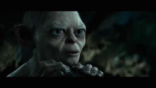 Gollum From The Lord Of The Rings Is Smiling With His Eyes Closed And His Hands On His Face GIF
