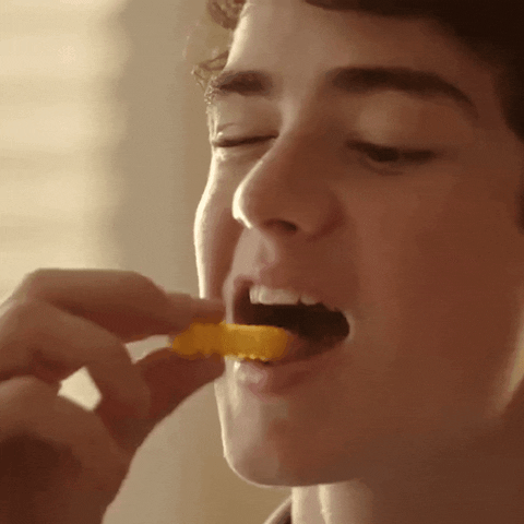 Good Looking Young Guy Enjoying Chip GIF