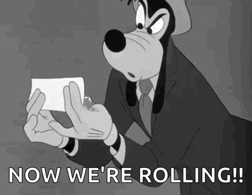 Goofy Holding Paper Saying Now We're Rolling GIF