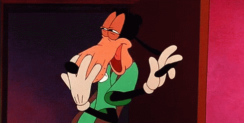 Goofy Is A Cartoon Character From Mickey Mouse Making A Funny Face And Giving The Middle Finger . GIF