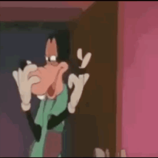 Goofy Is Making A Funny Face In A Cartoon While Standing In Front Of A Door . GIF