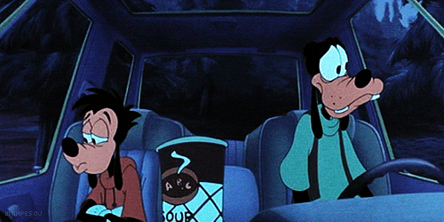 Goofy Is Sitting In The Back Seat Of A Car With A Cup Of Soup GIF