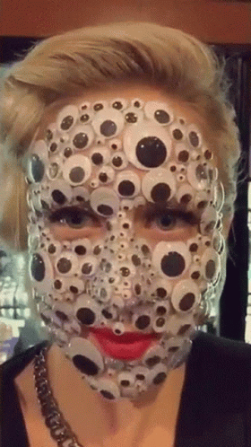 Face Full Of Googly Eyes GIF